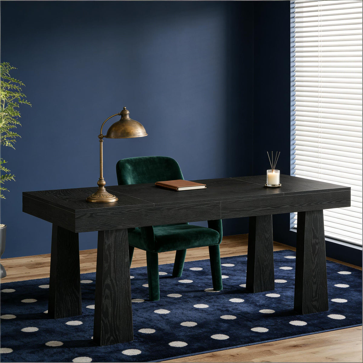 Dark wood desk with green chair against 
